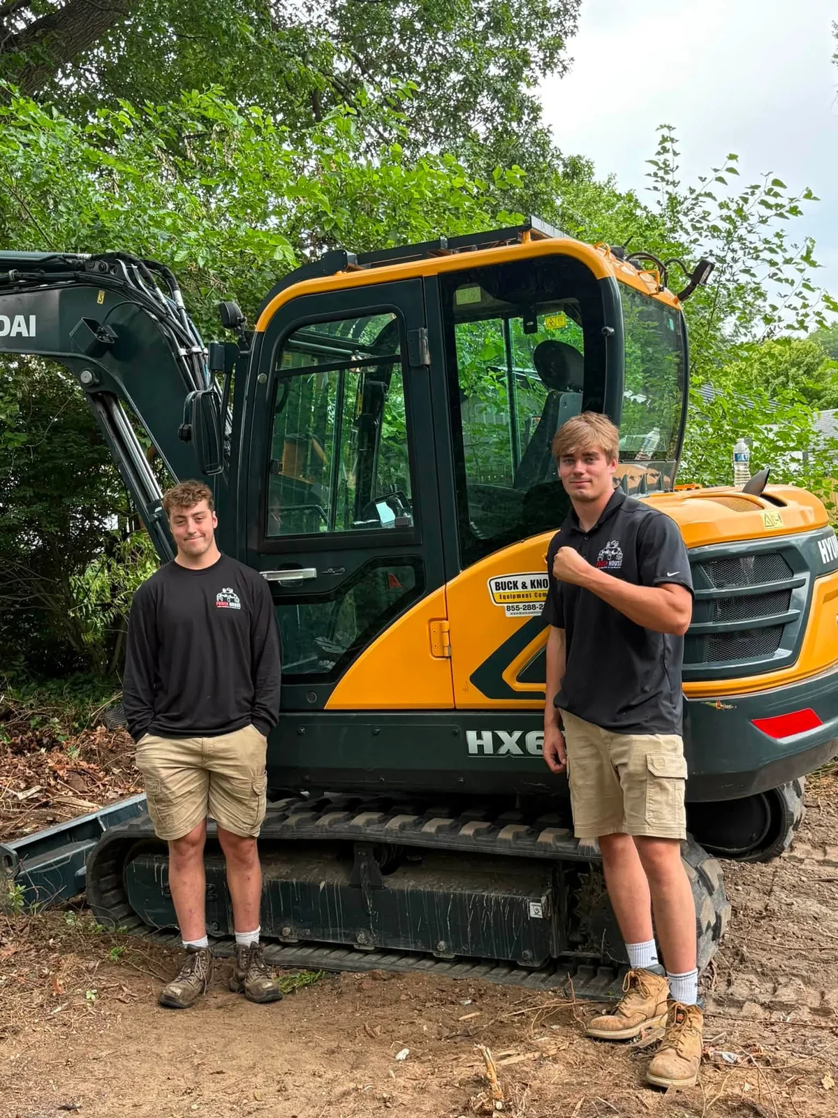 The founders of Power House Junk Removal & Demolition with their excavator in Northwest Ohio